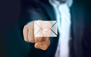 Finger clicking email icon